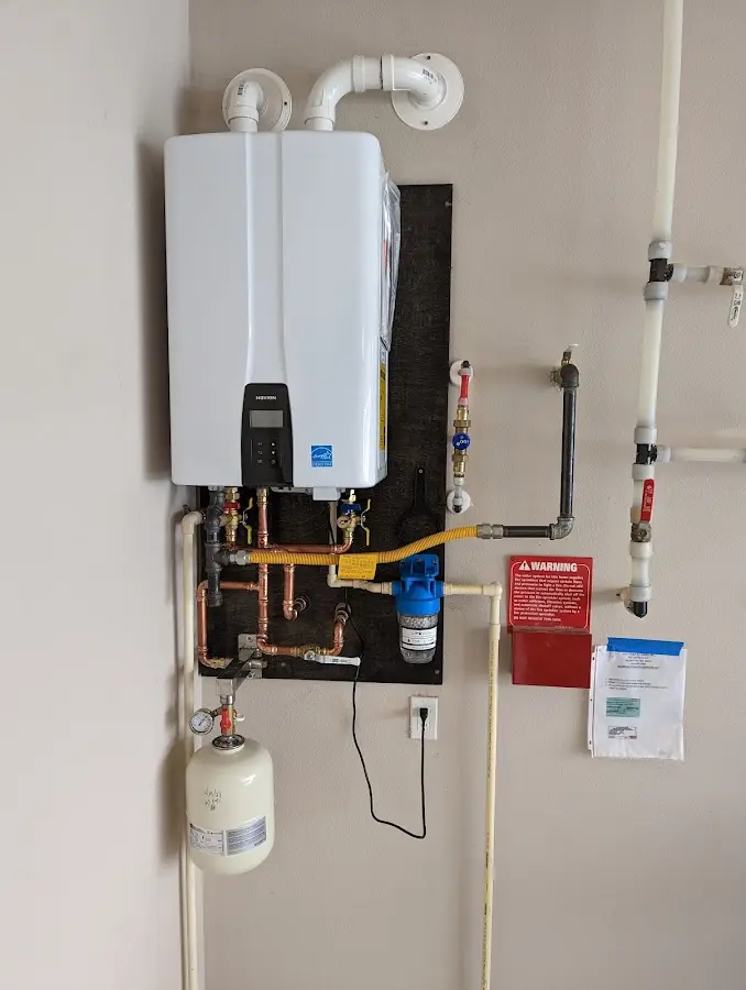 Professional plumber installing copper piping in a Fairview Park home